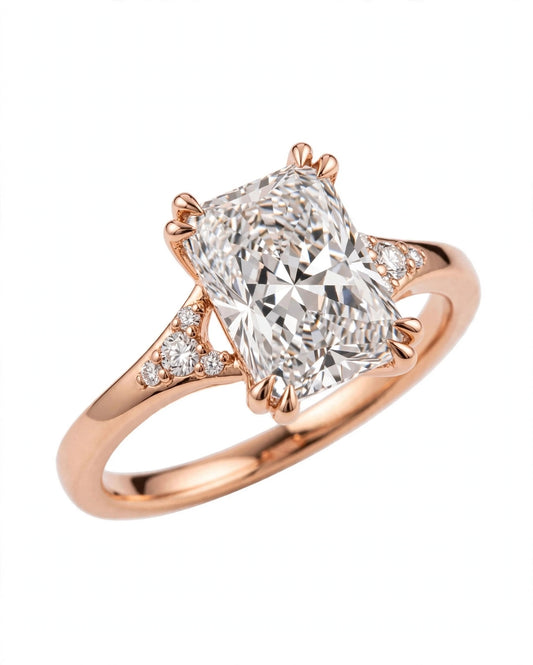Radiant-cut engagement ring with cluster side stones.