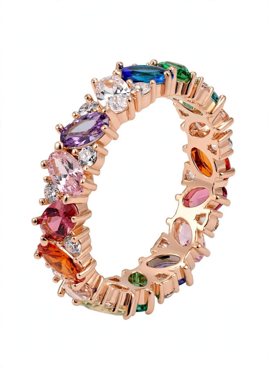 Oval-cut rainbow gemstone eternity ring.