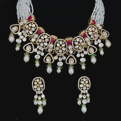 Uncut diamond with ruby red gems, green bead drops, and multi-strand pearl bead strings jewelry set.