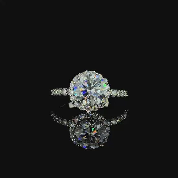 White gold round-cut diamond halo engagement ring.