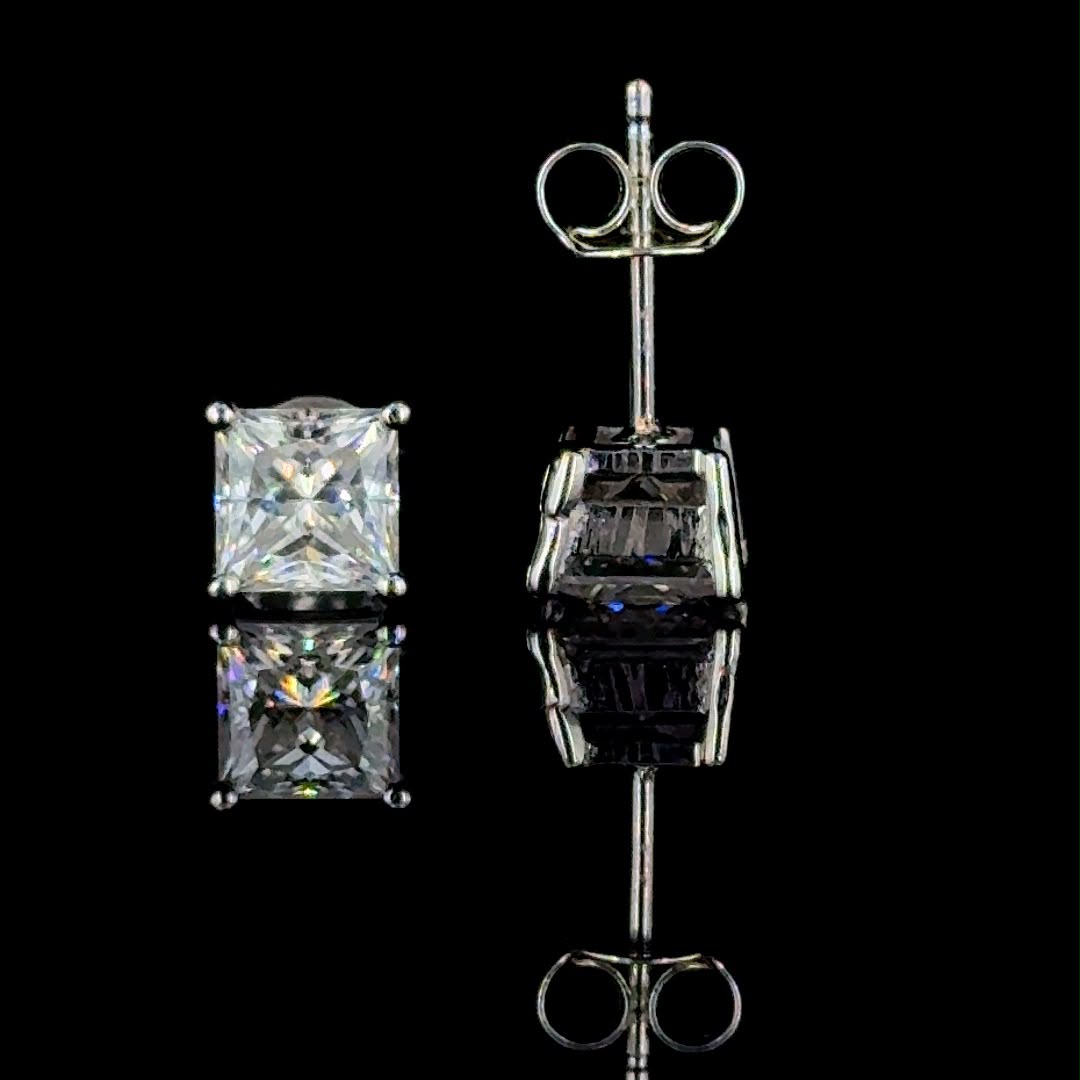 Classic princess-cut diamond stud earrings.