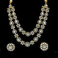 Gold-plated double-layered Polki and Kundan-style stone necklace set.