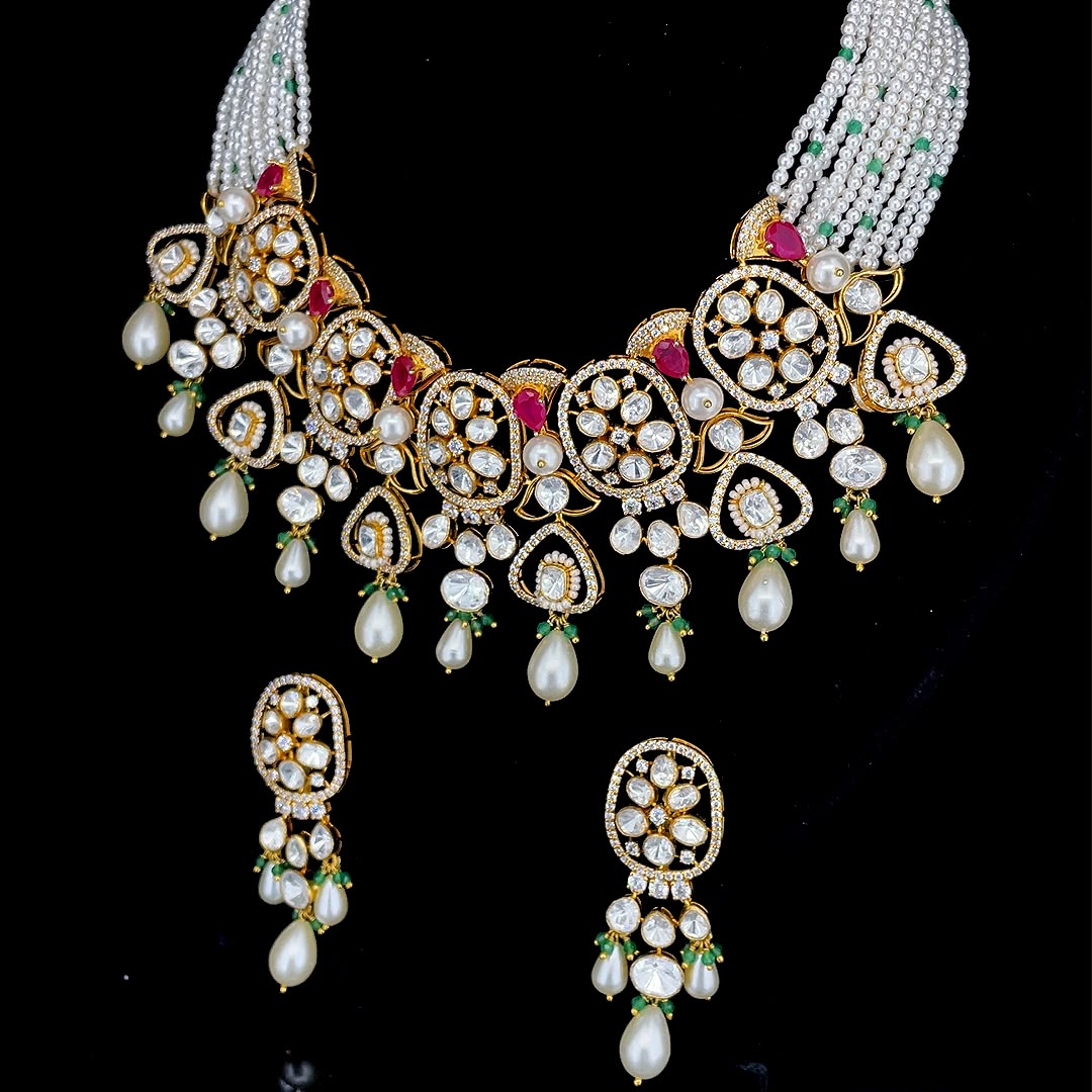 Uncut diamond with ruby red gems, green bead drops, and multi-strand pearl bead strings jewelry set.