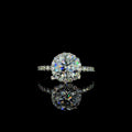 White gold round-cut diamond halo engagement ring.