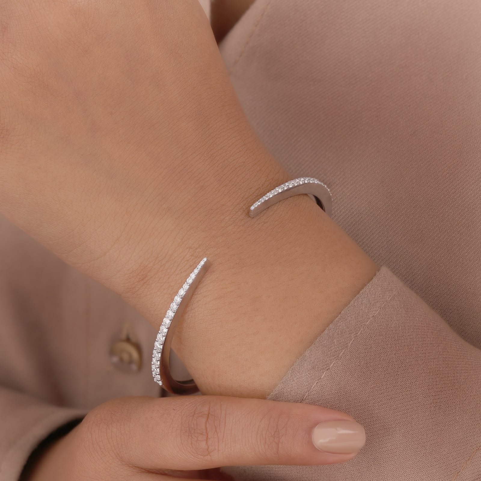 Round-cut white zirconia crystals open cuff bangle.