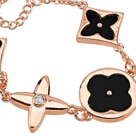 14K Rose Gold Mixed Motif Black Enamel Charm Bracelet.