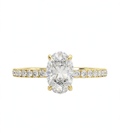 18K Yellow Gold Elongated Oval Cut Diamond Engagement Ring with Micro-Pavé Band.