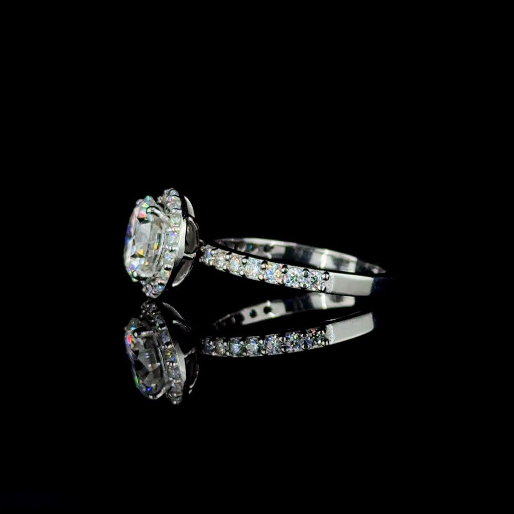 White gold round-cut diamond halo engagement ring.