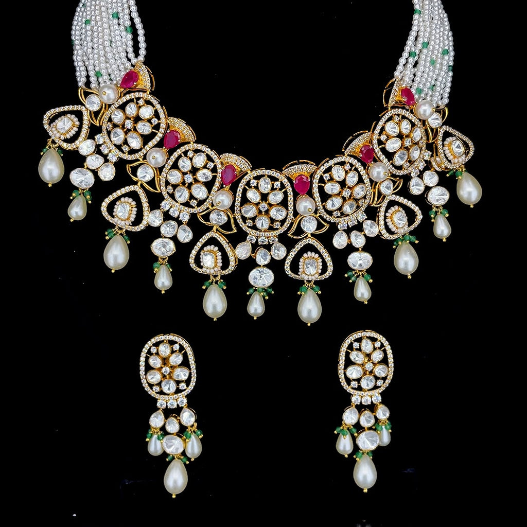 Uncut diamond with ruby red gems, green bead drops, and multi-strand pearl bead strings jewelry set.
