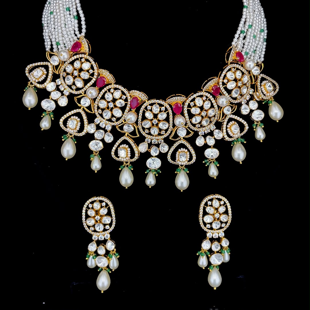 Uncut diamond with ruby red gems, green bead drops, and multi-strand pearl bead strings jewelry set.