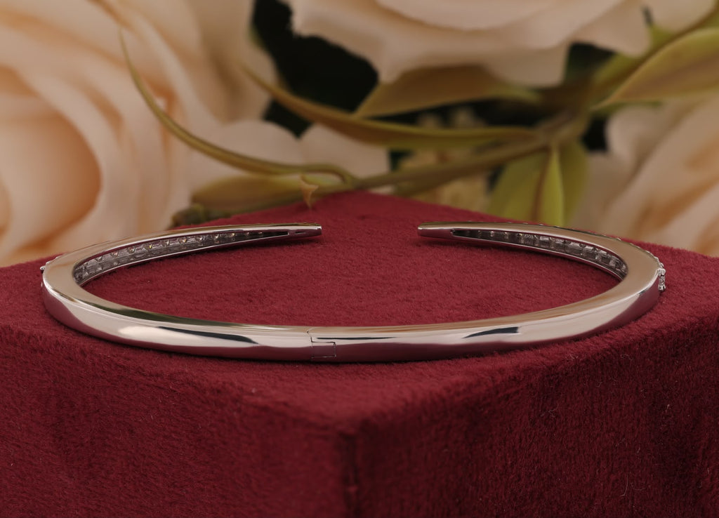 Round-cut white zirconia crystals open cuff bangle.