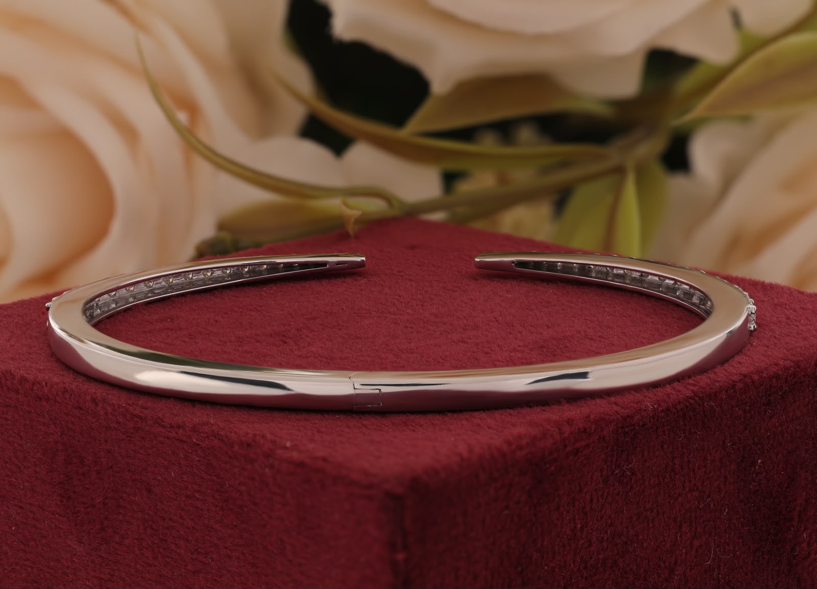 Round-cut white zirconia crystals open cuff bangle.