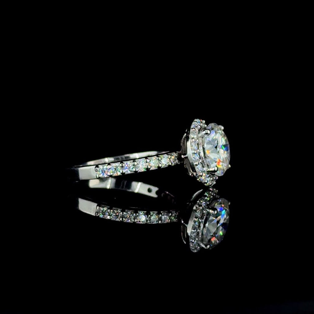 White gold round-cut diamond halo engagement ring.