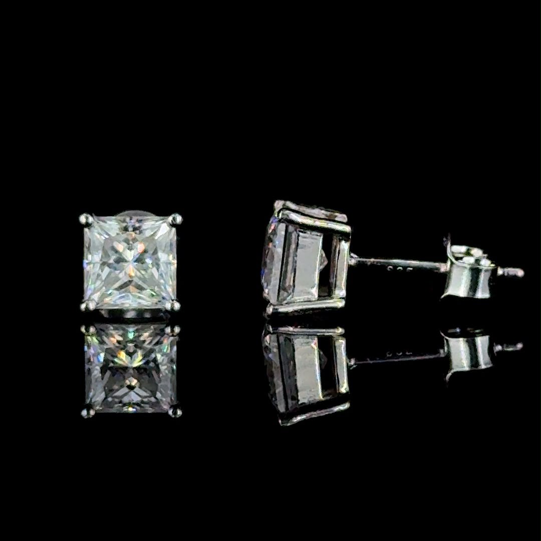 Classic princess-cut diamond stud earrings.