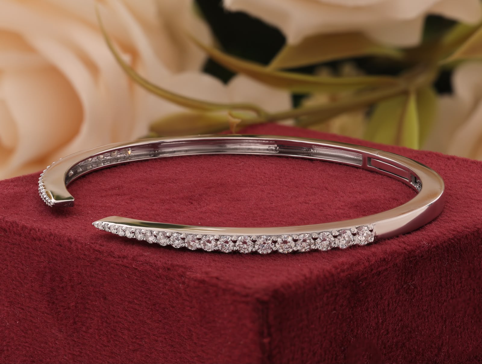Round-cut white zirconia crystals open cuff bangle.
